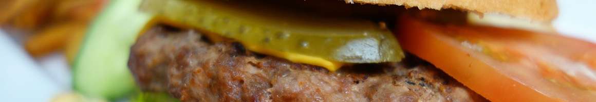 Eating Burger Chicken Wing Pub Food at BoomerJack's Grill & Bar restaurant in Denton, TX.